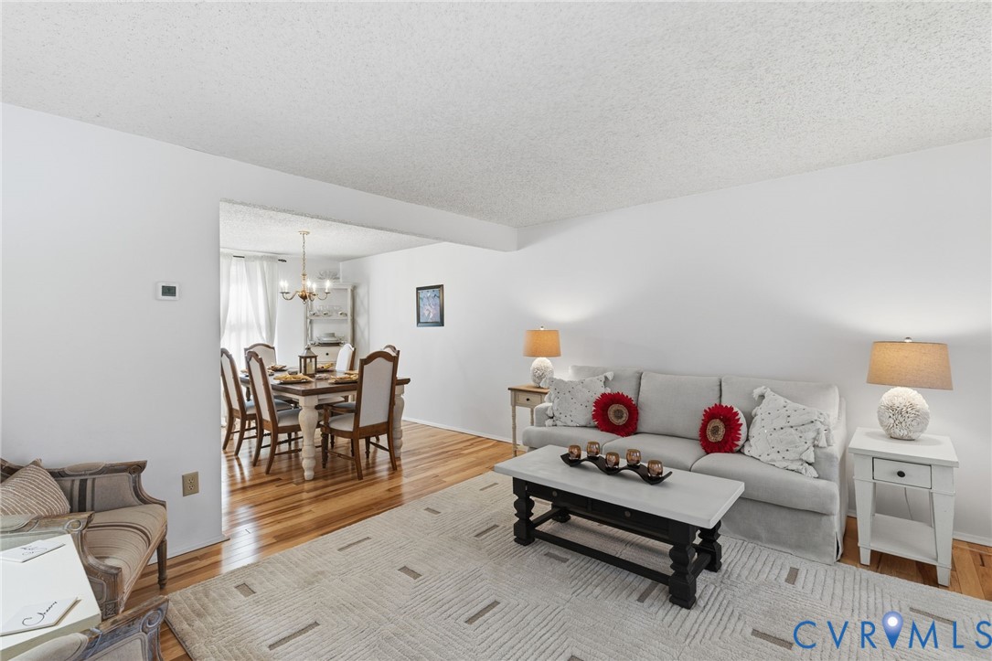 9643 Snowhill Road Richmond, VA 23235 - Photo 3 of 30 a living room with furniture and a chair