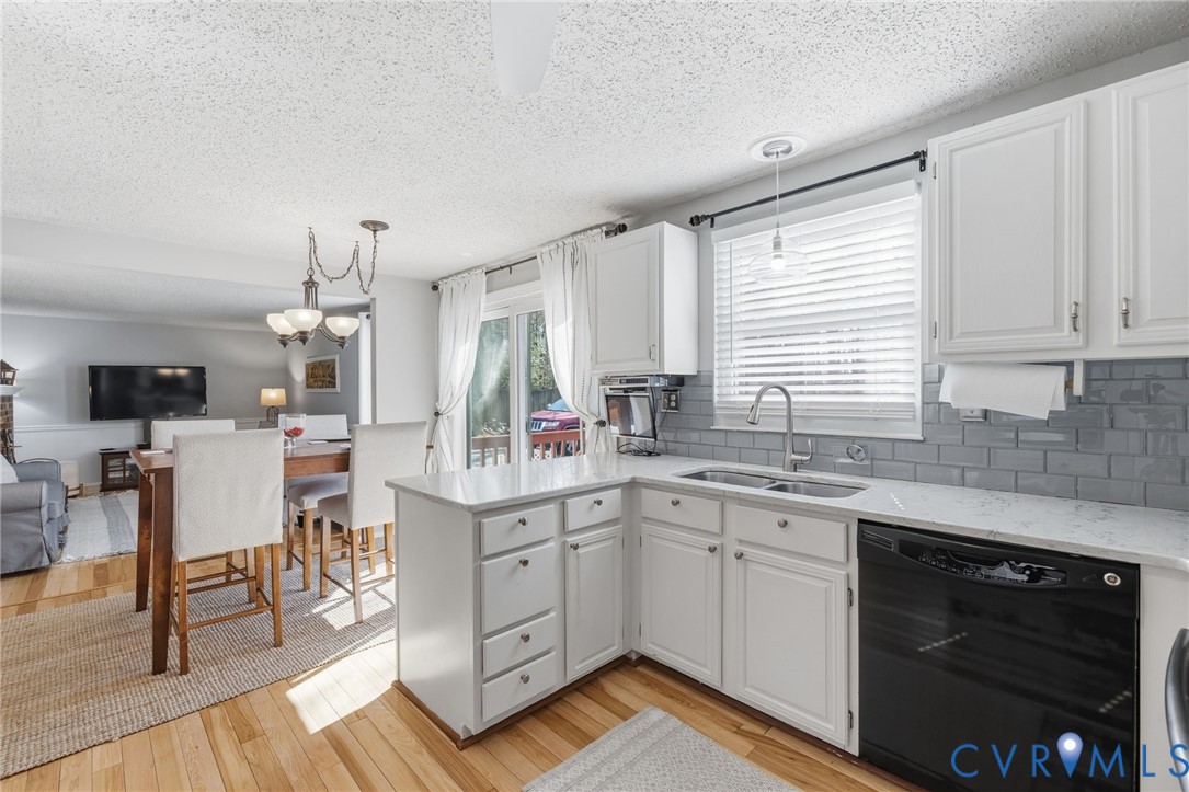 9643 Snowhill Road Richmond, VA 23235 - Photo 8 of 30 a kitchen with a sink cabinets and window