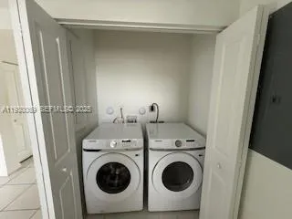 a utility room with dryer and washer