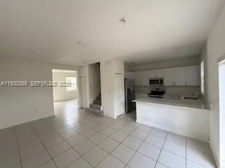 a view of a kitchen with a sink