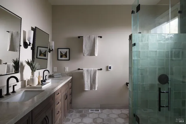 a bathroom with a sink a toilet and mirror
