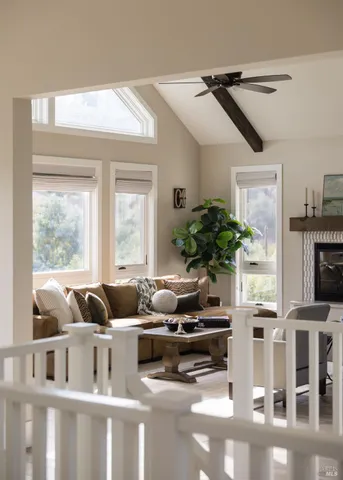 a living room with furniture cabinets and a window