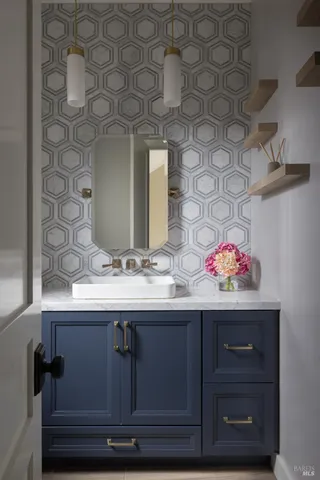 a bathroom with a sink and a mirror