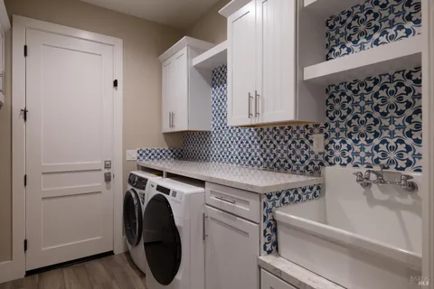 a view of a lake with a table and chairs