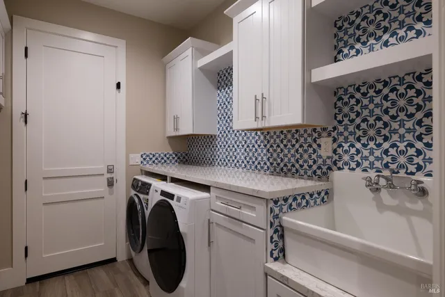 a view of a lake with a table and chairs