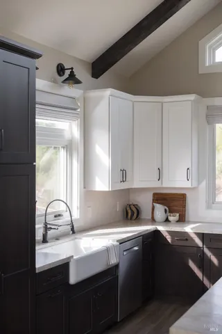 a kitchen with a sink and cabinets