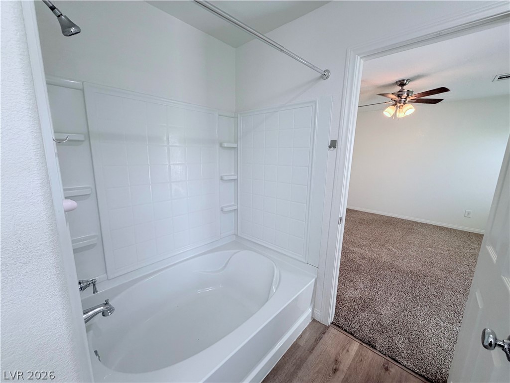 3610 Wireless Court Las Vegas, NV 89129 - Photo 8 of 15 A pristine tub and shower combination awaits within this well-maintained bathroom.