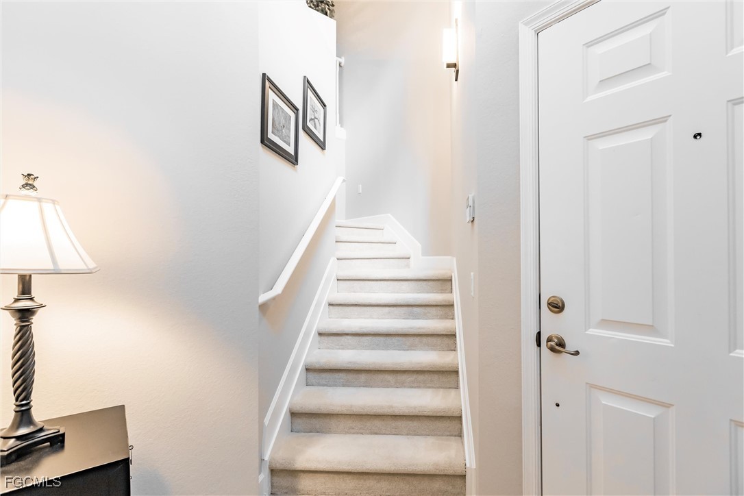 3121 Meandering Way, Unit 201 Fort Myers, FL 33905 - Photo 7 of 39 a view of an entryway with staircase