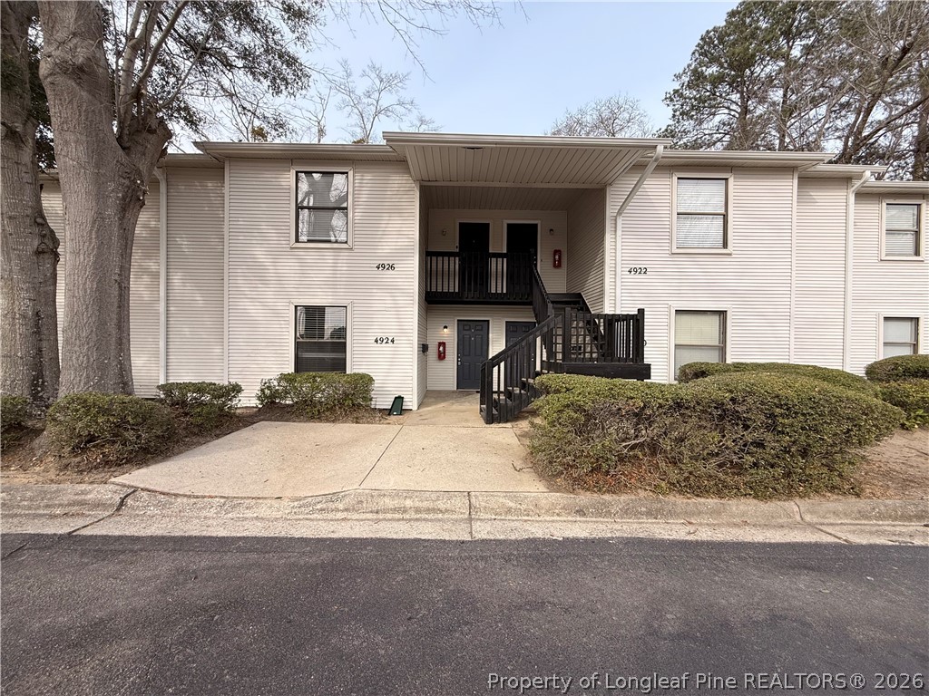 4924 Cameron Road Hope Mills, NC 28348 - Photo 1 of 13 a front view of a house with a yard and garage
