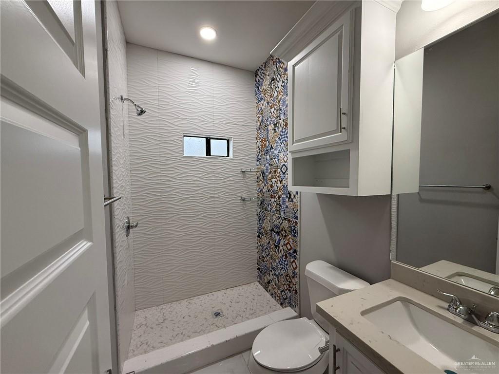 4195 Chapotito Street Rio Grande City, TX 78582 - Photo 9 of 15 a bathroom with a sink toilet and shower
