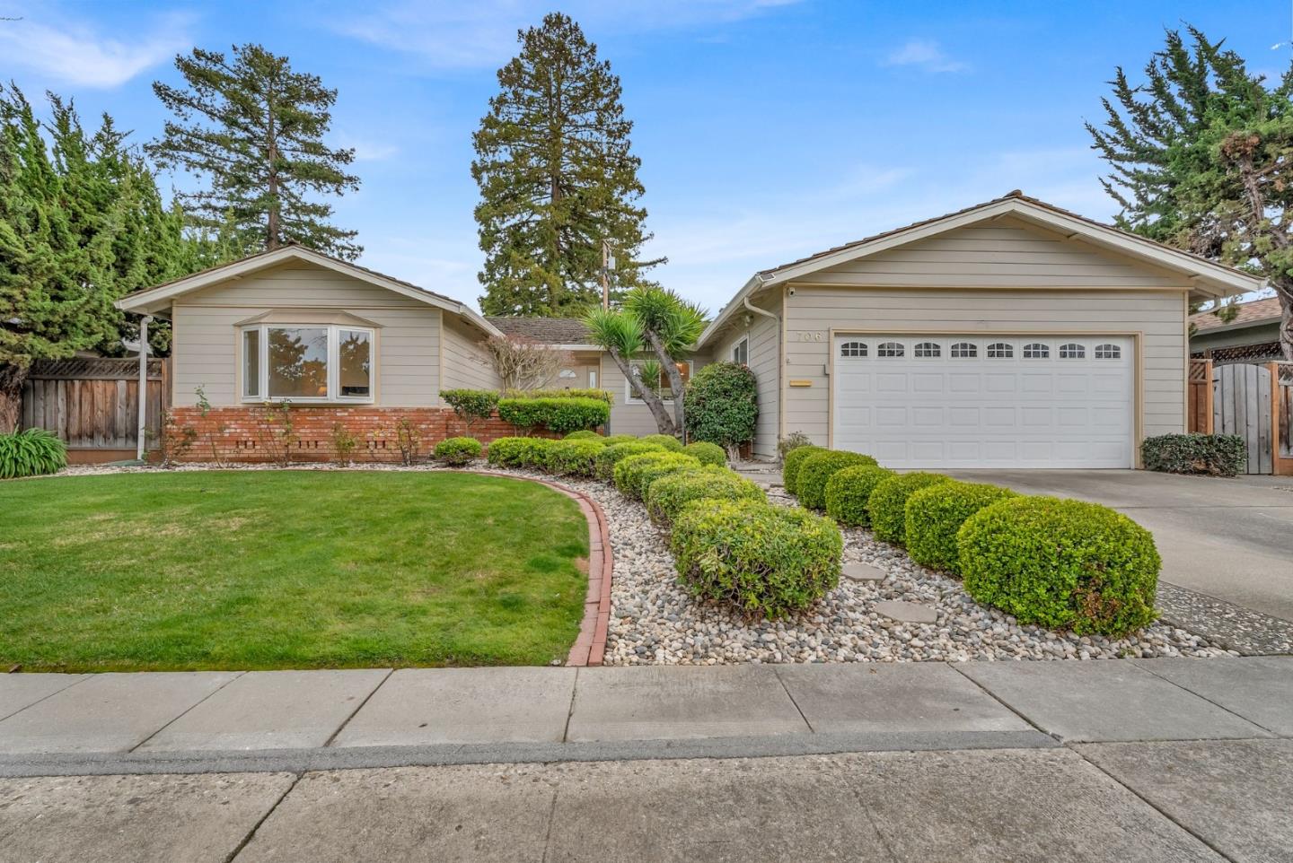 706 Saranac Drive Sunnyvale, CA 94087 - Photo 1 of 1 a front view of a house with a yard and garage