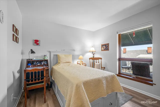 a bedroom with a bed and a fireplace