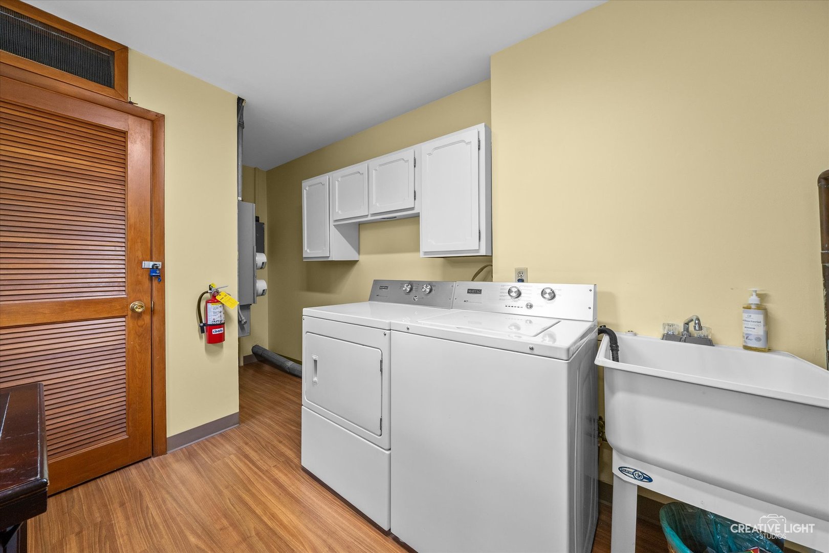 450 West Downer Place, Unit 4C Aurora, IL 60506 - Photo 11 of 16 a utility room with dryer and washer