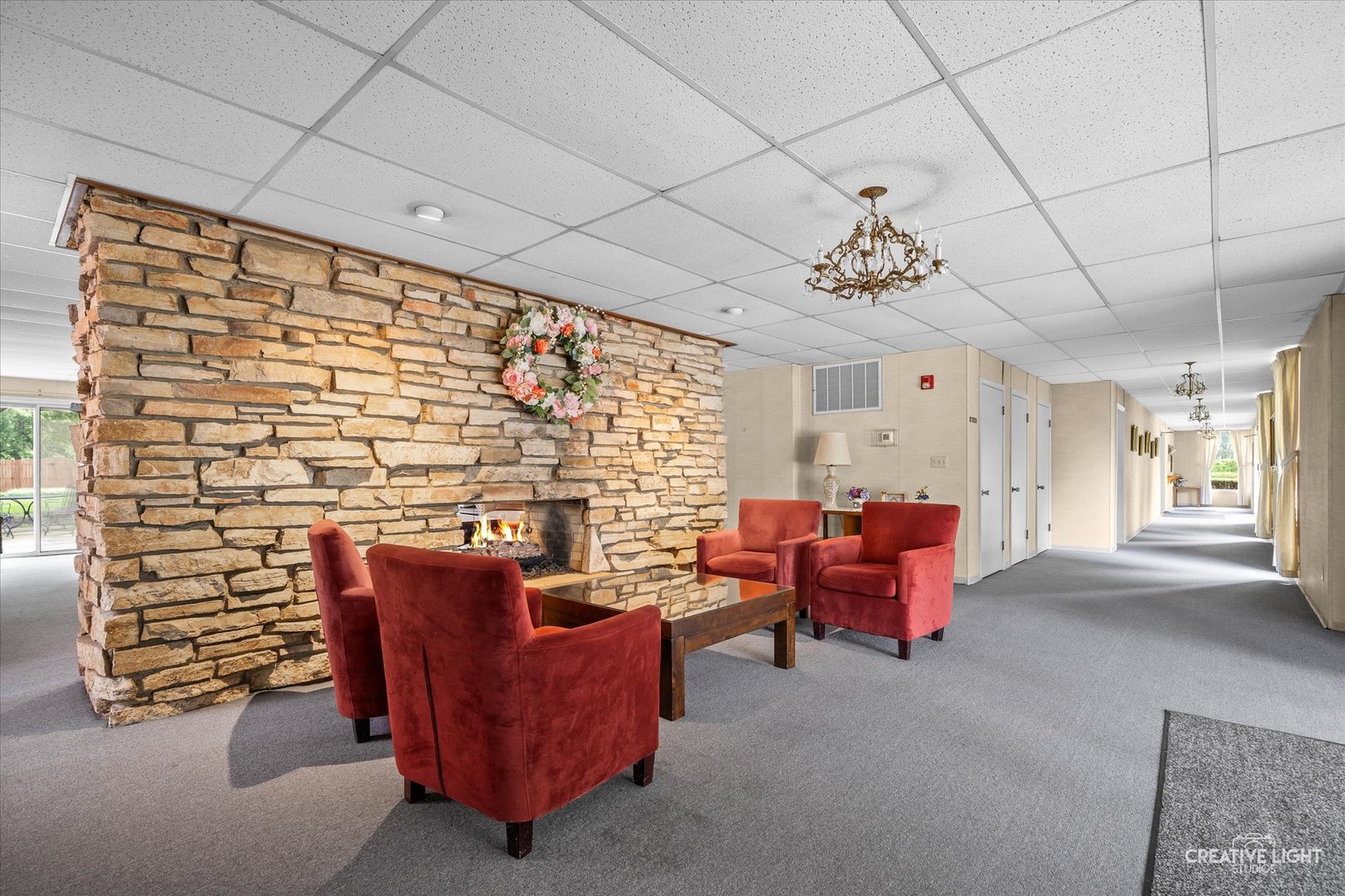 450 West Downer Place, Unit 4C Aurora, IL 60506 - Photo 15 of 16 a living room with furniture and a fireplace