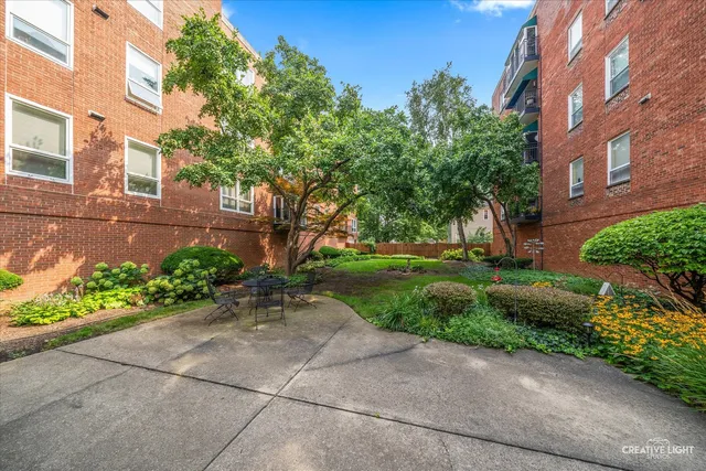 a front view of a building with garden