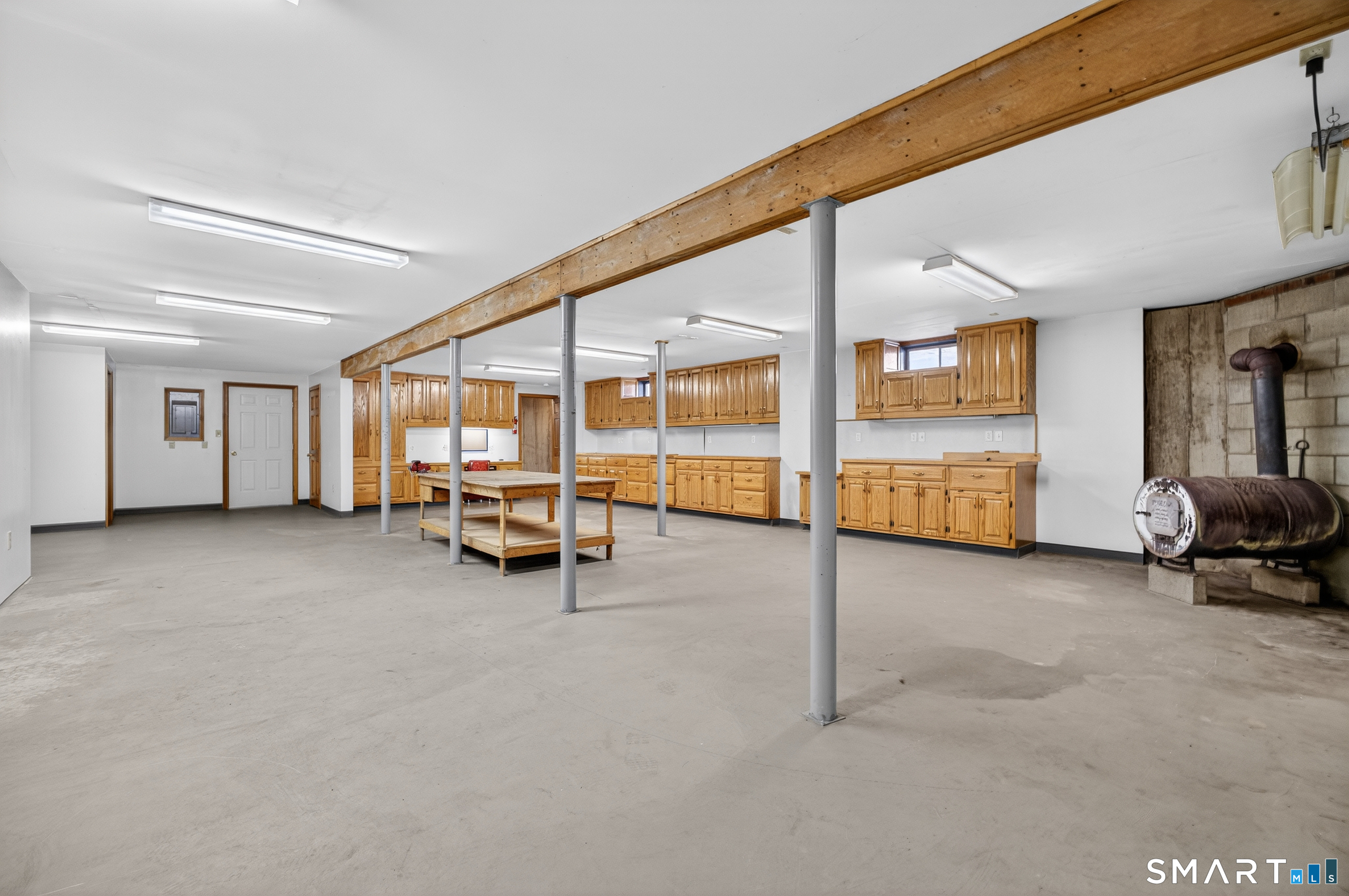 61 Edwards Road Bethany, CT 06524 - Photo 22 of 30 Partially Finished Lower Level. Currently Used as Workshop. Easy conversion to fully finished space!