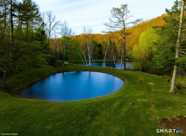 a view of a swimming pool with an outdoor space and seating area