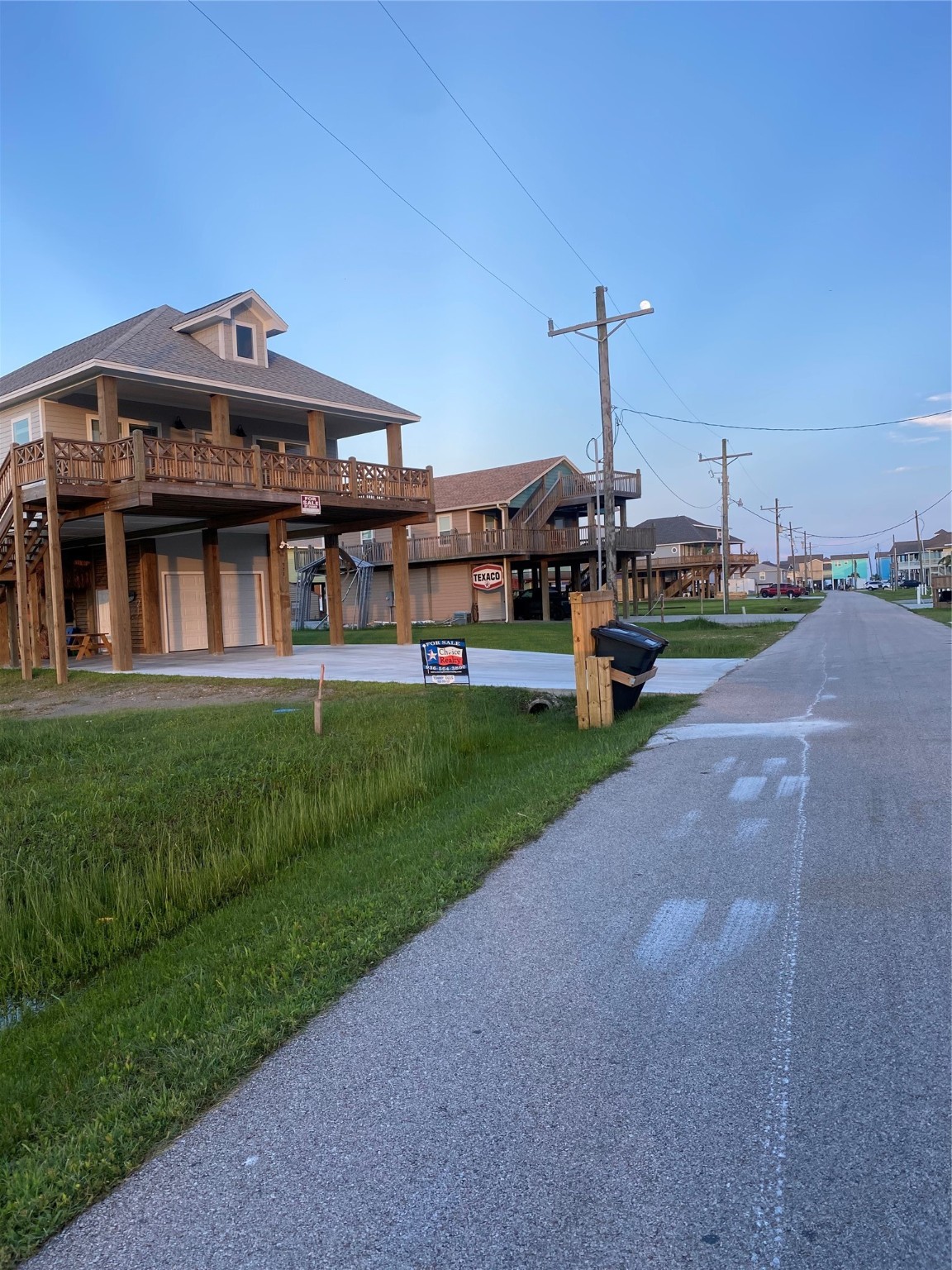 982 Tidelands Crystal Beach, TX 77650 - Photo 2 of 3 a view of a house with a big yard and potted plants