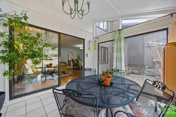a view of a dining room with furniture window and outside view