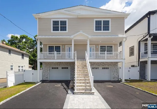 a front view of a house with a garage