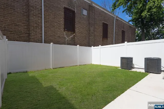 a backyard of a house with seating space