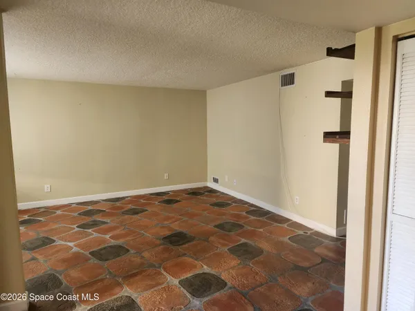 a view of a kitchen from the hallway