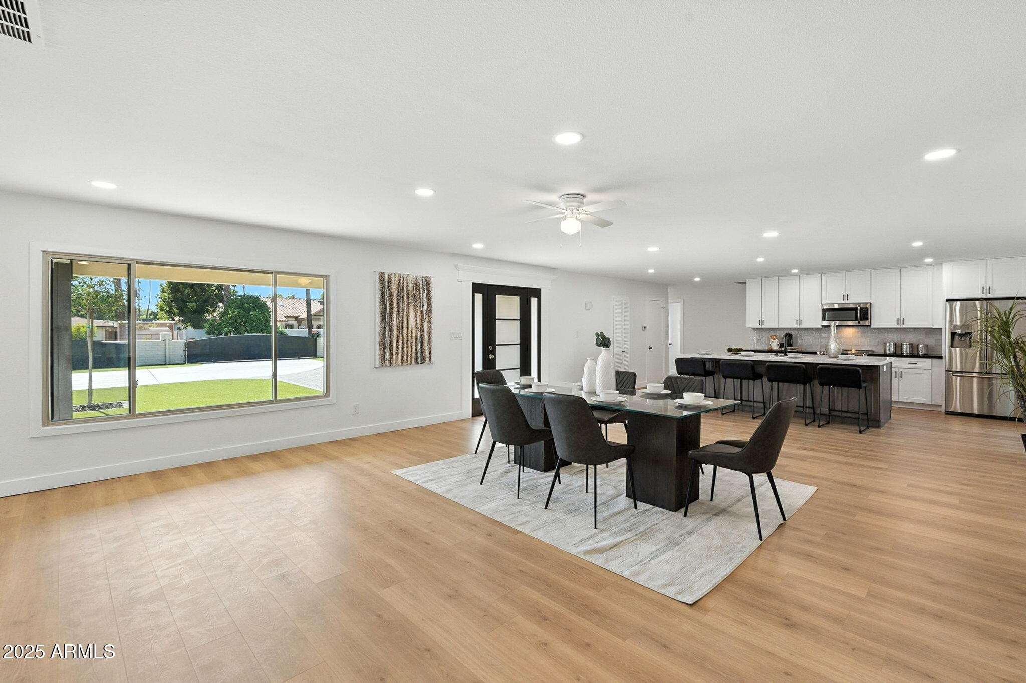 7637 North 7th Avenue Phoenix, AZ 85021 - Photo 15 of 57 a view of a dining room with furniture and wooden floor