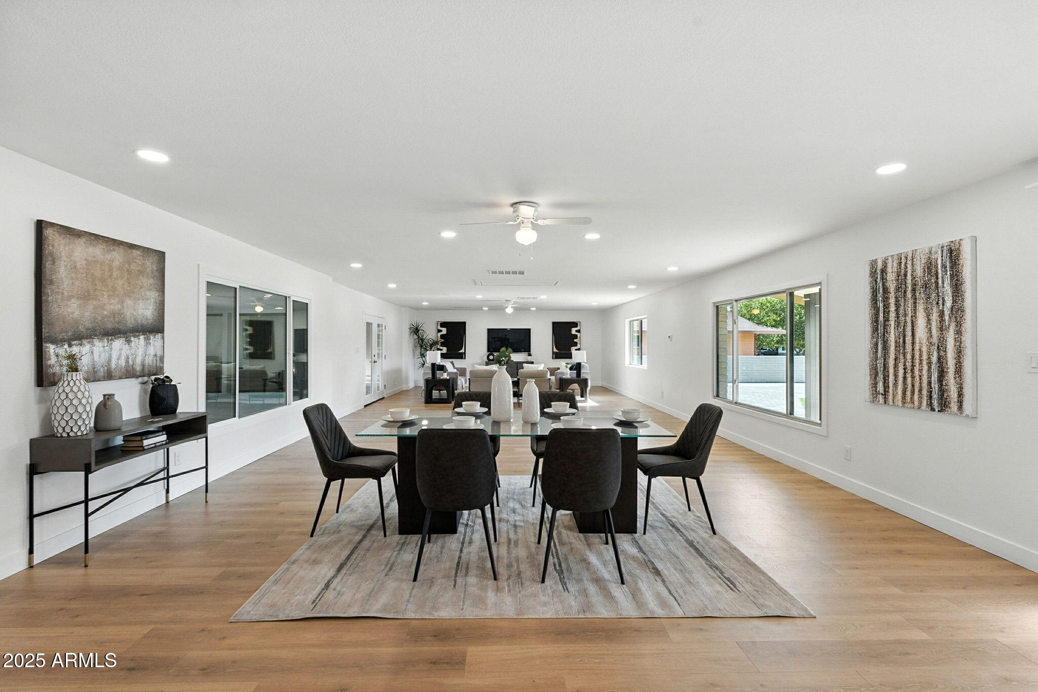 7637 North 7th Avenue Phoenix, AZ 85021 - Photo 19 of 57 a view of a dining room with furniture window and wooden floor