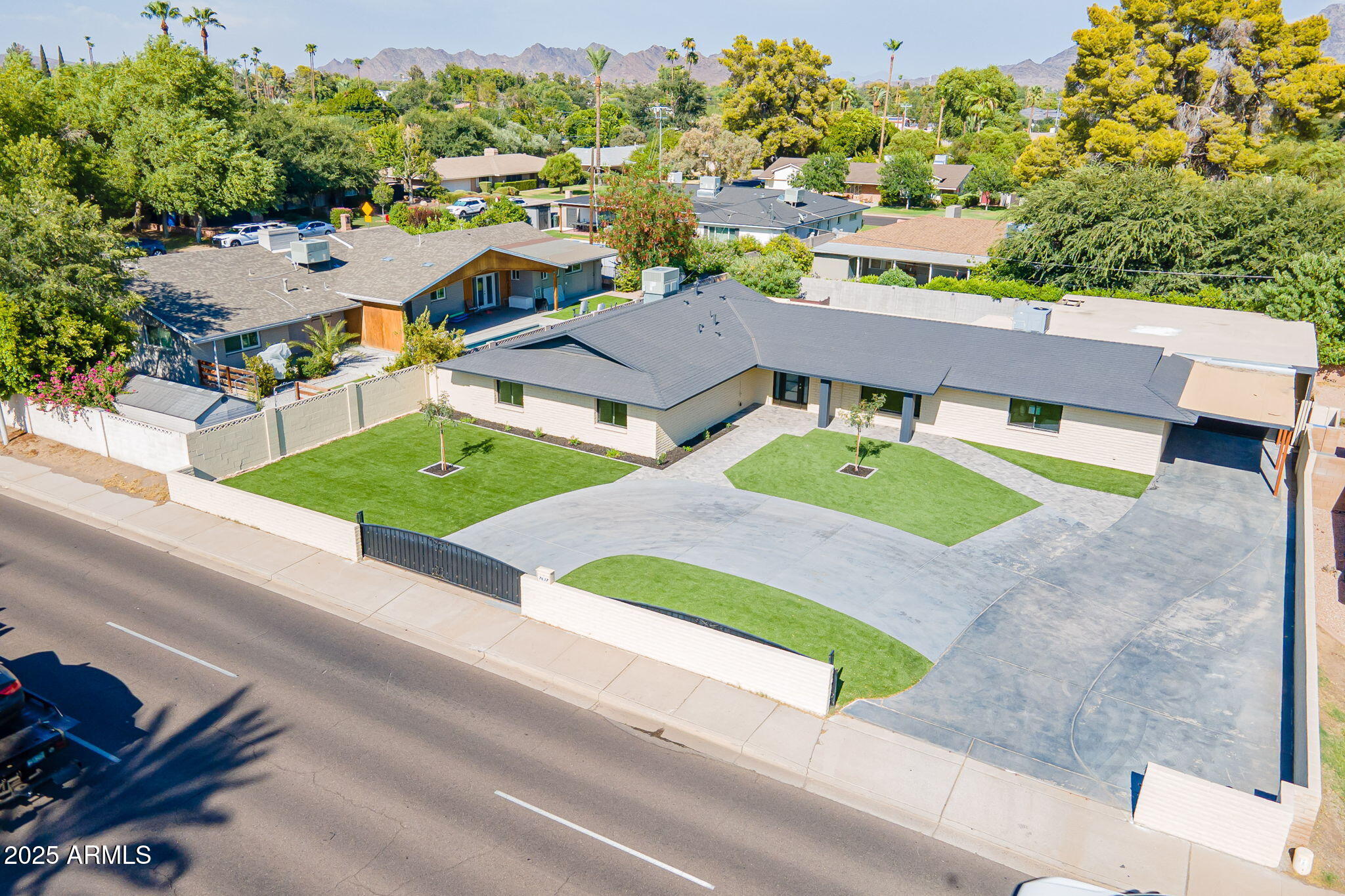 7637 North 7th Avenue Phoenix, AZ 85021 - Photo 2 of 57 an aerial view of a house with yard and mountain view in back