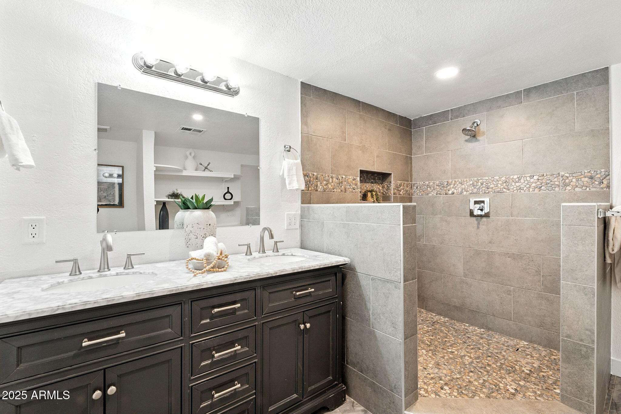 7637 North 7th Avenue Phoenix, AZ 85021 - Photo 31 of 57 a bathroom with a double vanity sink mirror double shower and a
