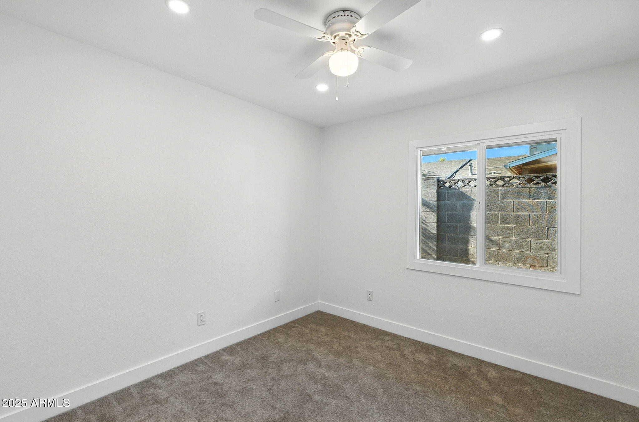 7637 North 7th Avenue Phoenix, AZ 85021 - Photo 32 of 57 an empty room with a window