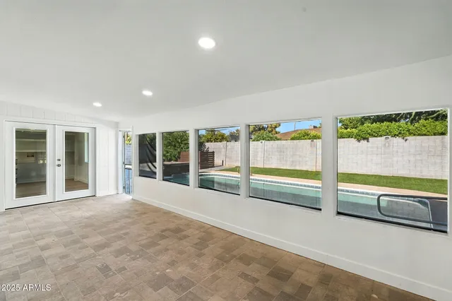 a view of a backyard with sitting area
