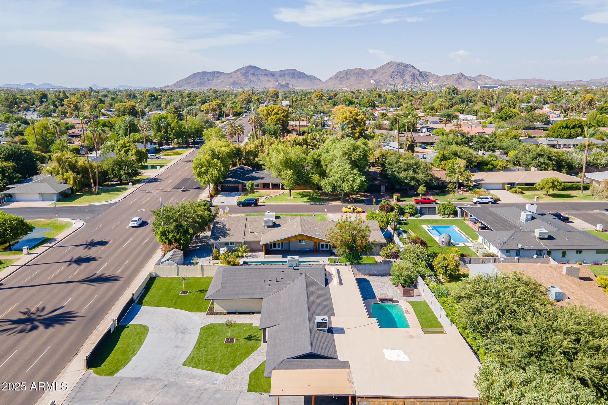 7637 North 7th Avenue Phoenix, AZ 85021 - Photo 56 of 57 an aerial view of a houses with a swimming pool