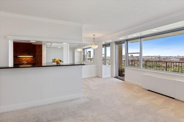 wooden floor in a room with a large window