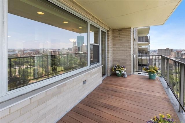 a porch with a table and chairs