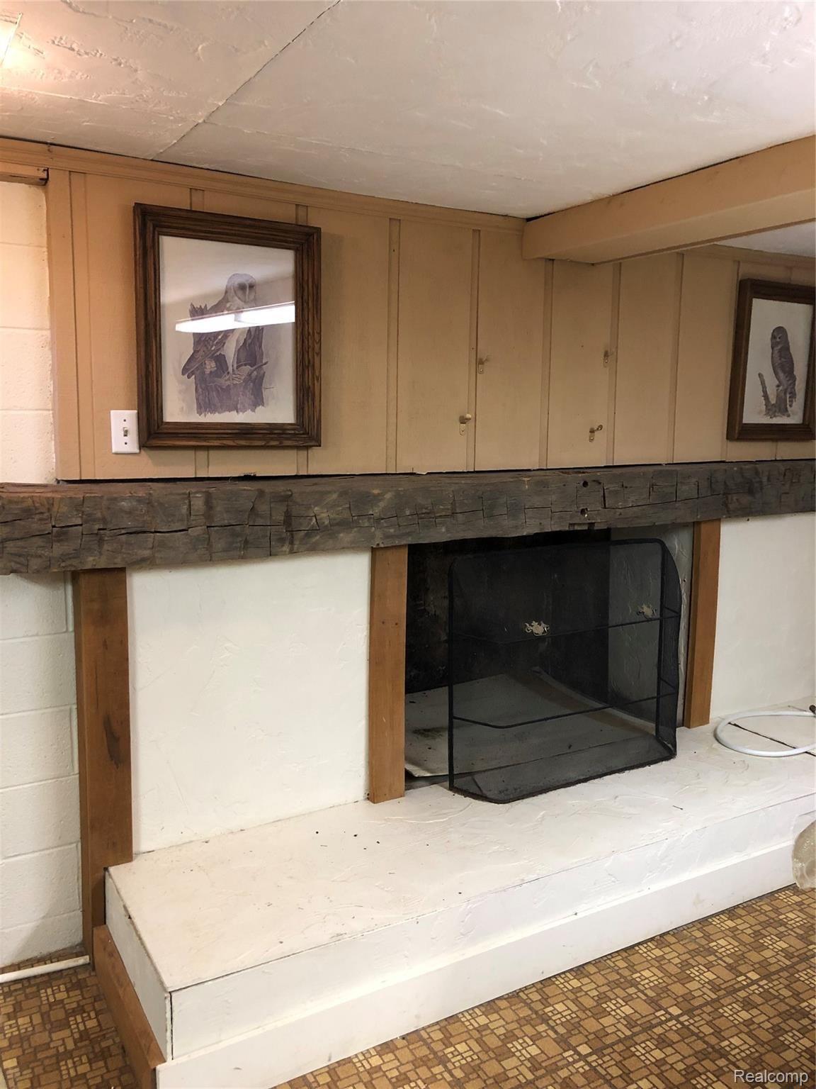 5208 Casey Road Dryden, MI 48428 - Photo 39 of 52 Gorgeous wood beam mantel above original wood fireplace
