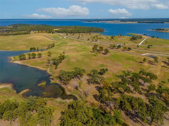 an aerial view of a residential building with an ocean view