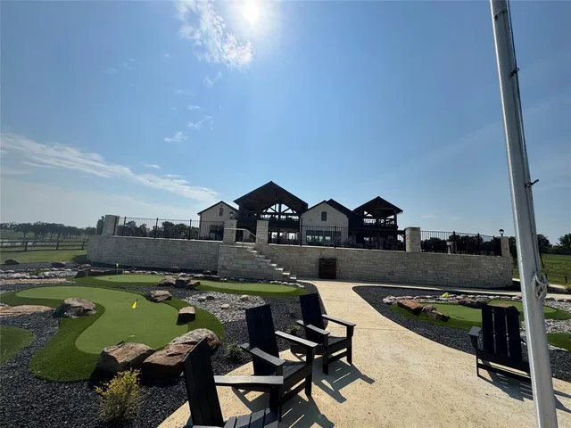 a living room with furniture a wooden floor and chandelier