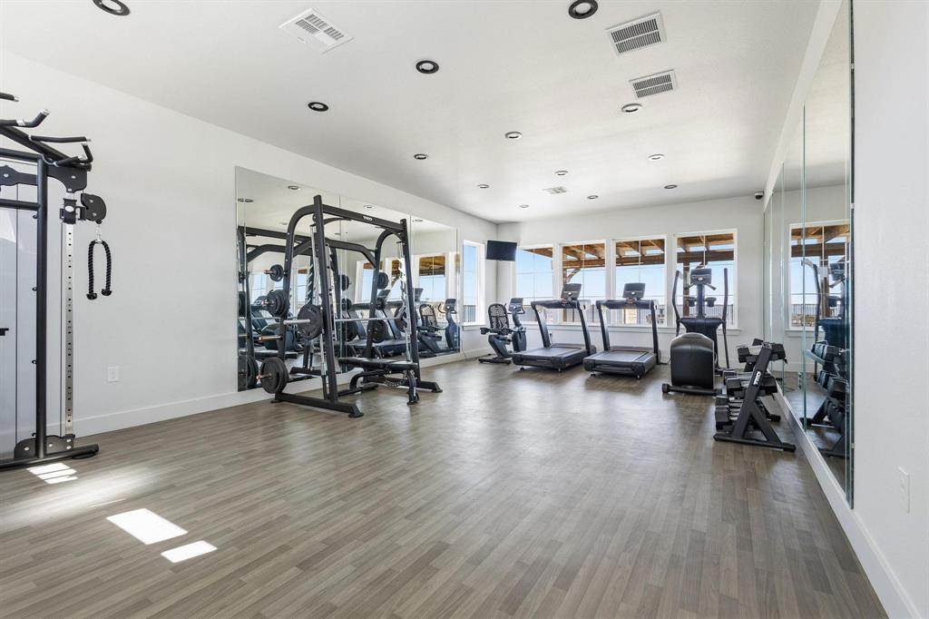 237 Lakeshore Terrace Windom, TX 75492 - Photo 30 of 35 a view of a room with gym equipment and a large window