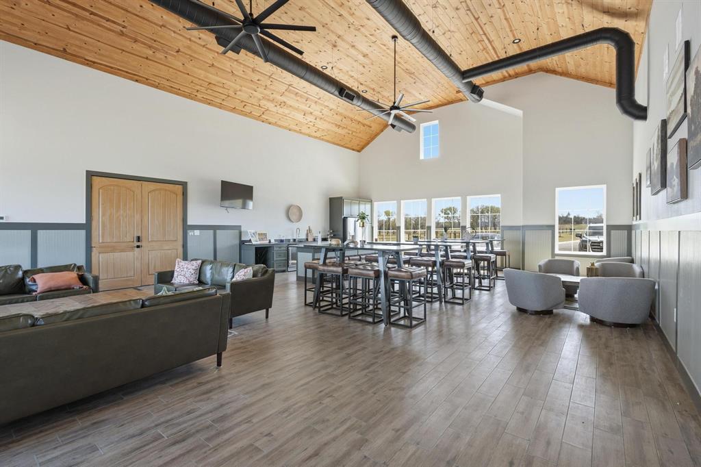 237 Lakeshore Terrace Windom, TX 75492 - Photo 31 of 35 a living room with lots of furniture and wooden floor
