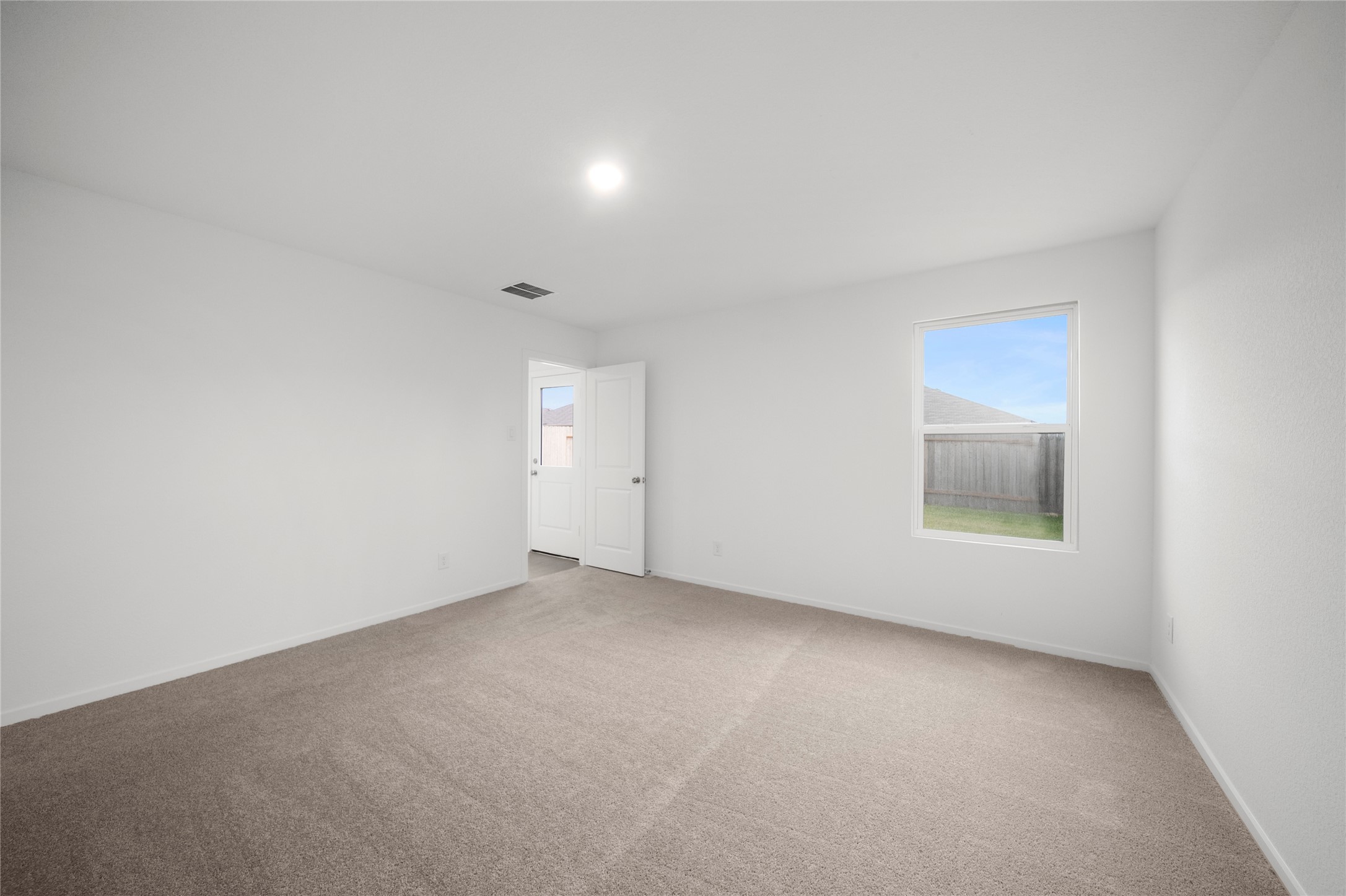 31436 Moore Road Magnolia, TX 77354 - Photo 13 of 25 an empty room with a window