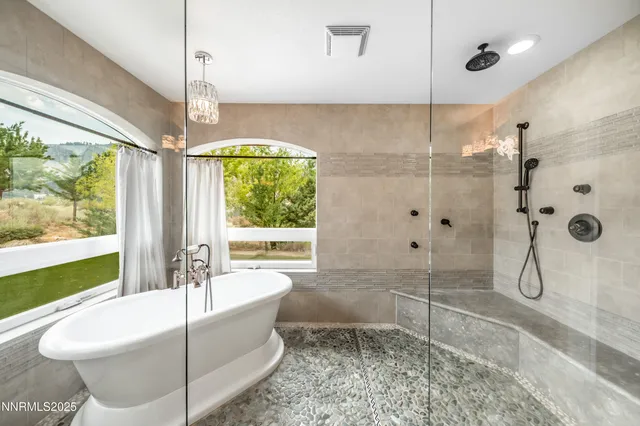 a bathroom with a tub and sink