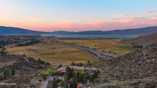 a view of a town with mountains in the background
