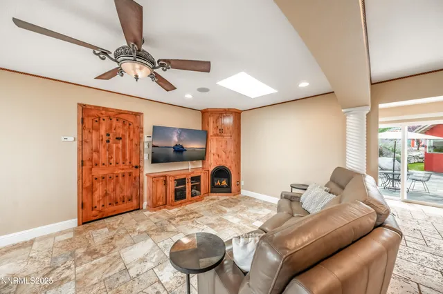 a kitchen with a sink cabinets and wooden floor
