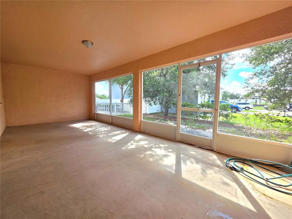 4284 High Ridge Avenue Spring Hill, FL 34609 - Photo 37 of 40 a view of a big room with wooden floor and windows