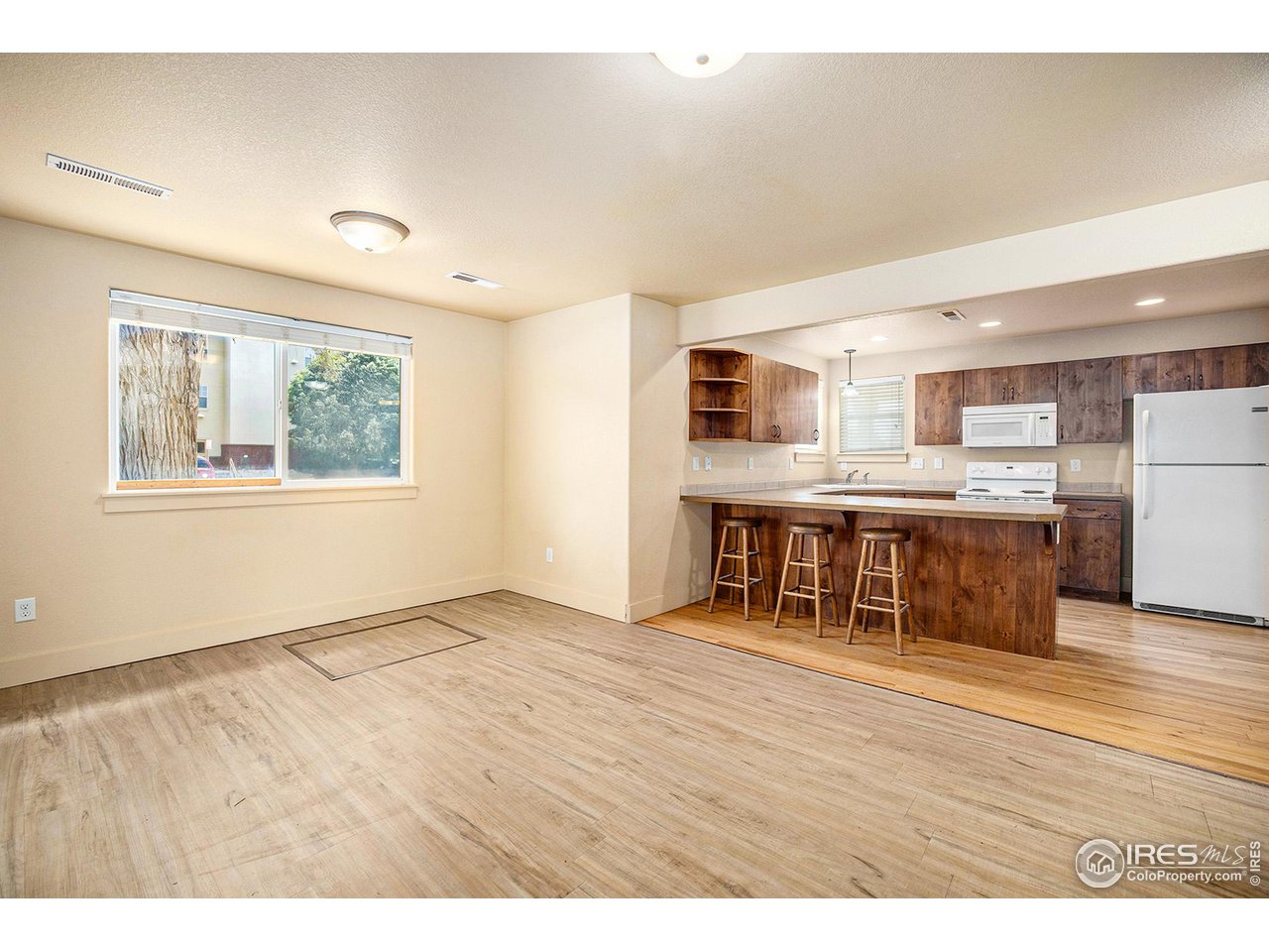 1001 23rd Street Road Greeley, CO 80631 - Photo 18 of 40 The living room has plenty of space for gathering