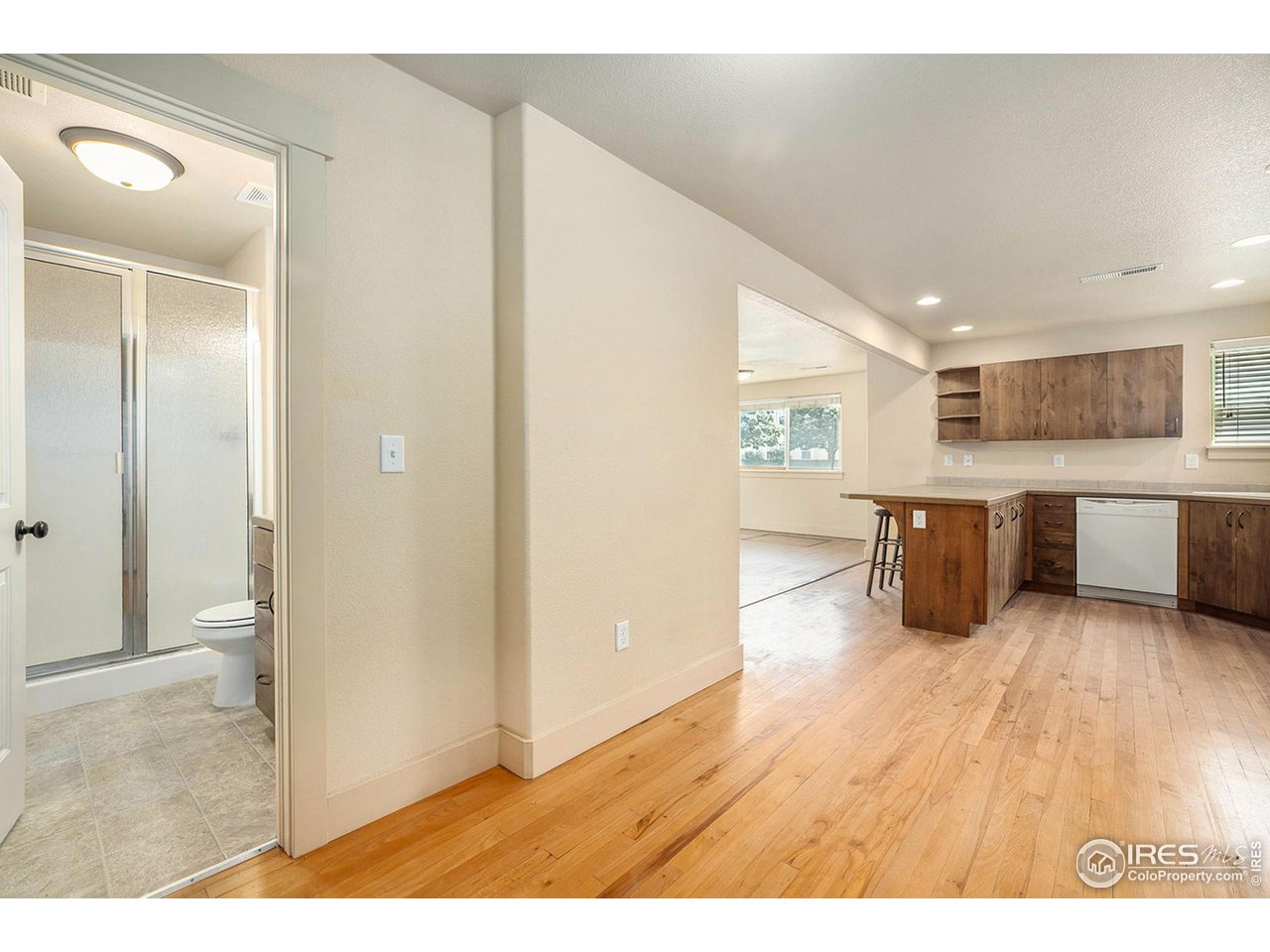 1001 23rd Street Road Greeley, CO 80631 - Photo 6 of 40 Wood flooring runs throughout