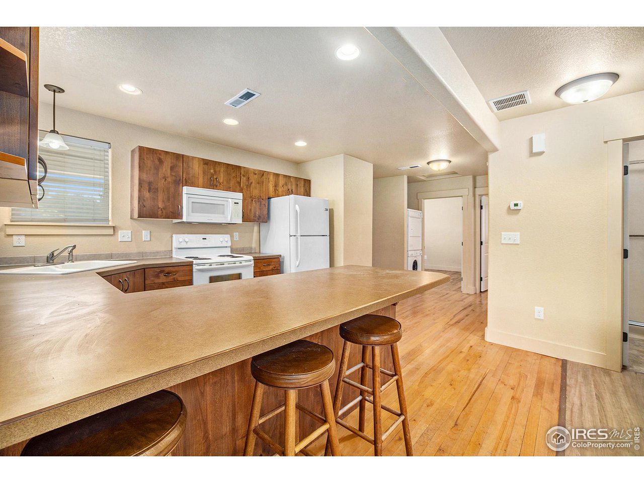 1001 23rd Street Road Greeley, CO 80631 - Photo 8 of 40 A convenient breakfast bar expands dining options