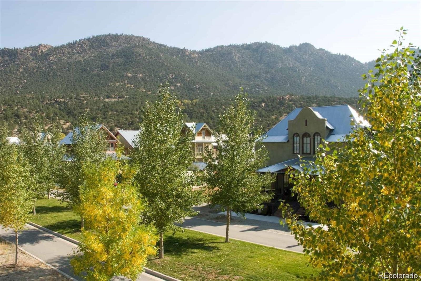 1025 Riverside Park Road Buena Vista, CO 81211 - Photo 2 of 6 a view of a house with a yard and a large tree