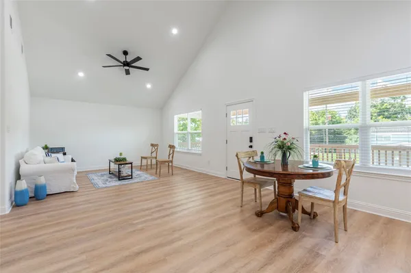 a view of a hallway with shelves and wooden floor